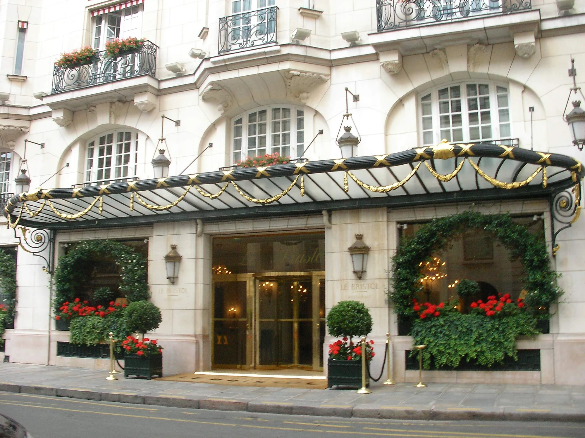 The pale stone façade and entrance canopy of Le Bristol Paris