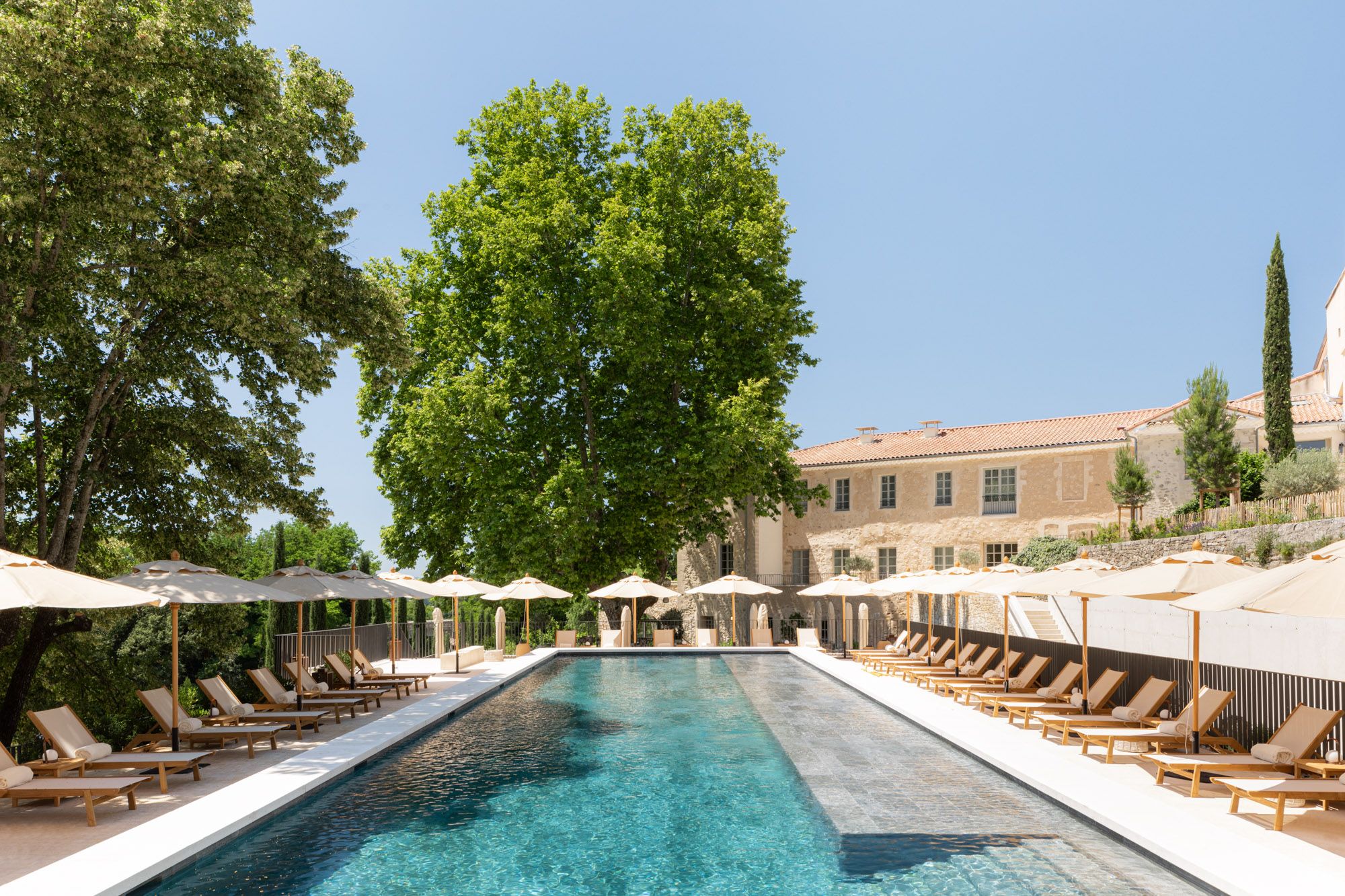The outdoor pool and historic buildings of Le Couvent des Minimes
